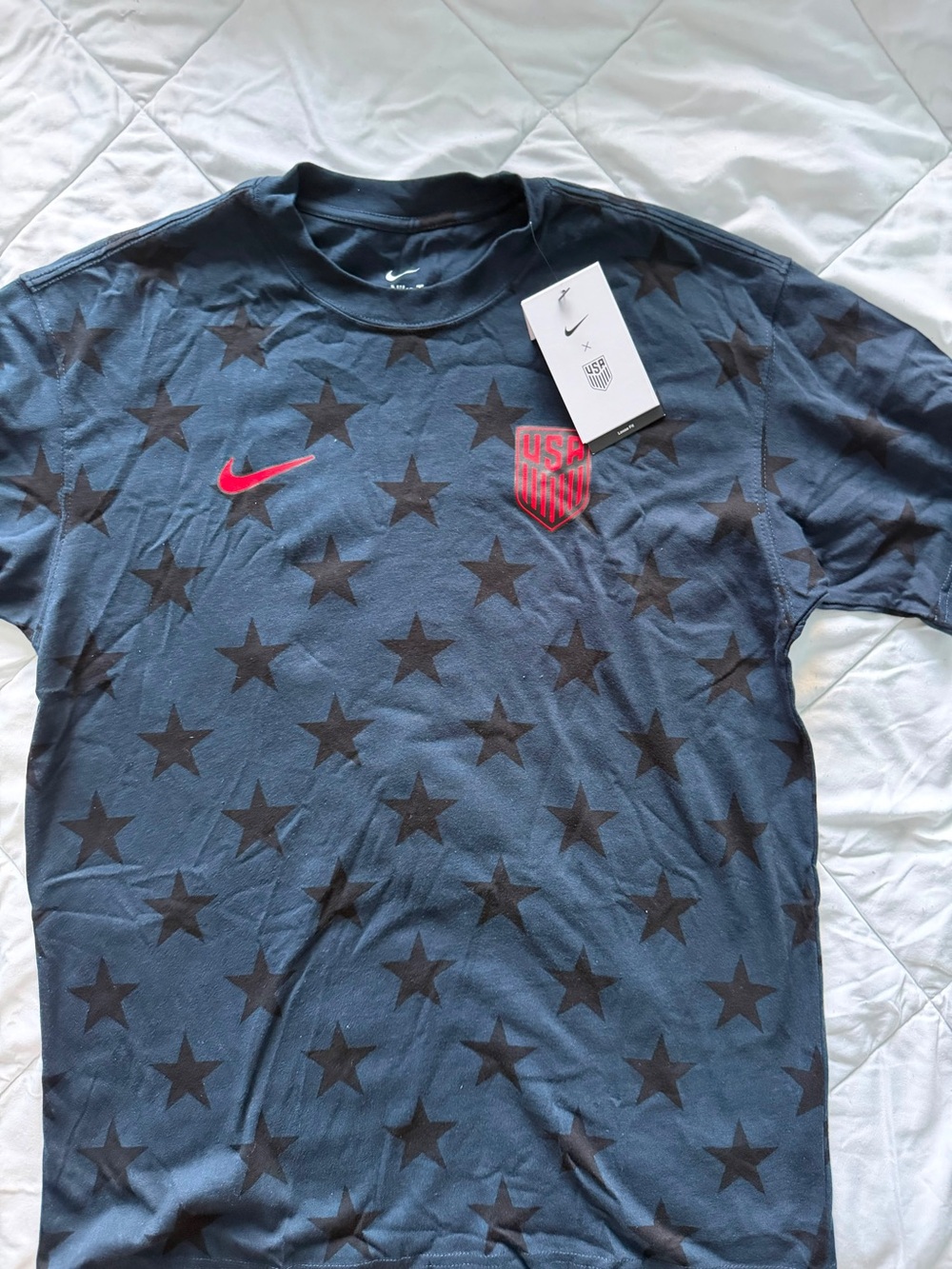 Nike Men’s Navy Star Graphic Tee with Red Swoosh and Crest